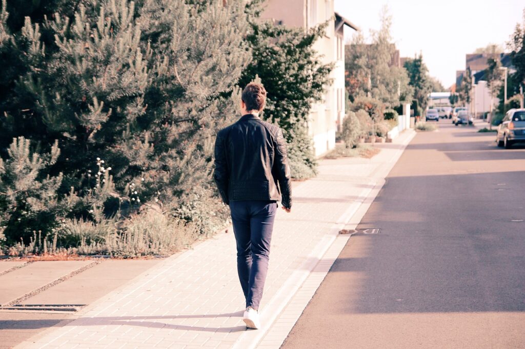 Man Walking a neighborhood